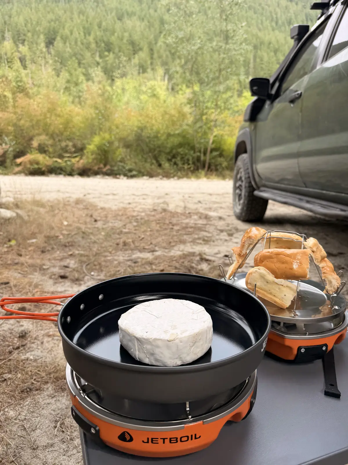 Compact camp kitchen cooking beside the Frontier