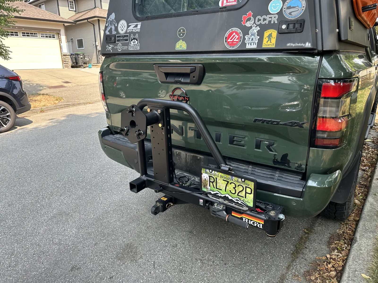 Rear spare-tire carrier mounted to the Frontier